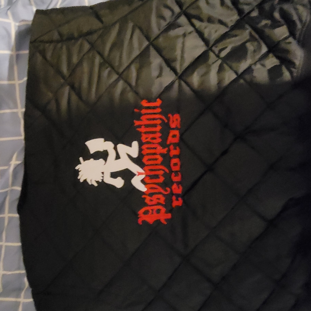 Black Quilted Jacket with Red and White Logo